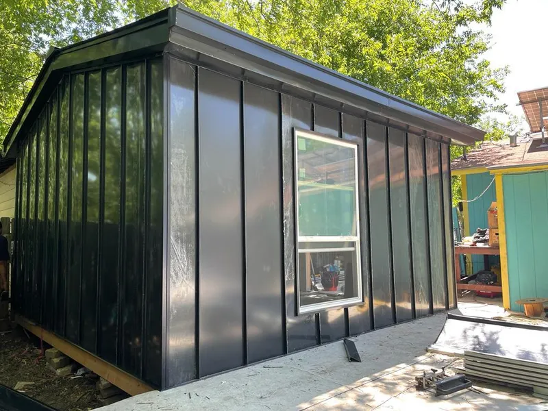 Black standing seam metal wall panels for Metal Roof Installation in Godley