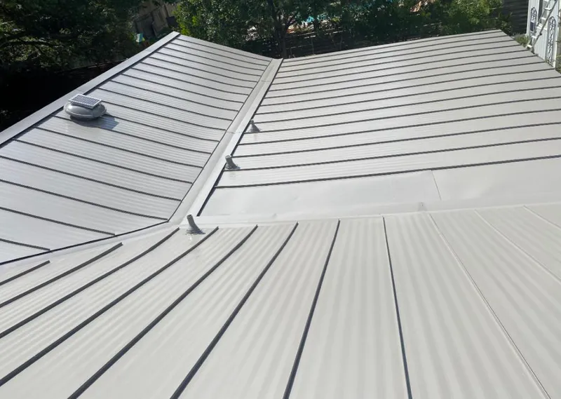 Solar attic fan installed on a metal roof for Roof Ventilation in Godley